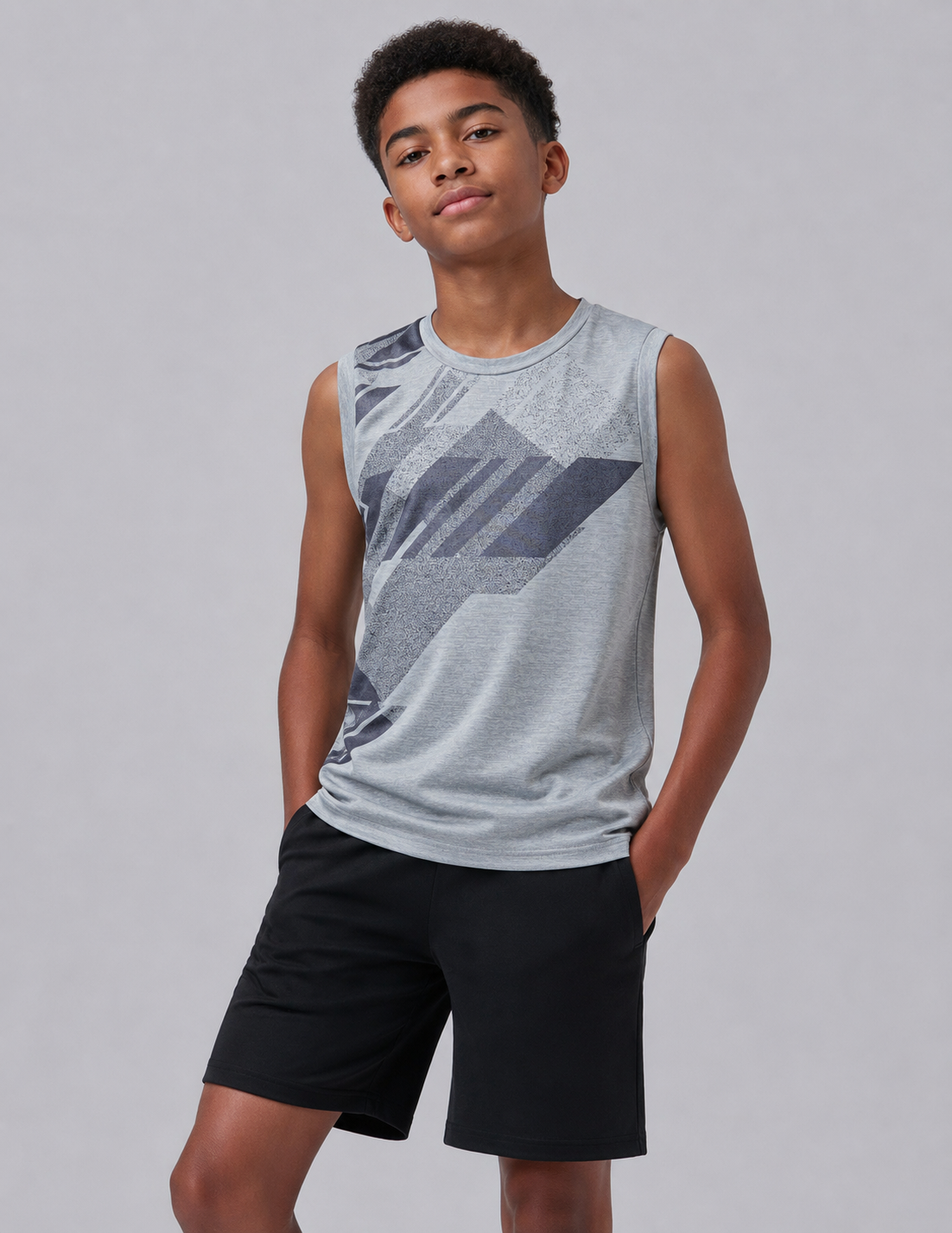 Boy wearing a gray Liberty Brands active tank top
